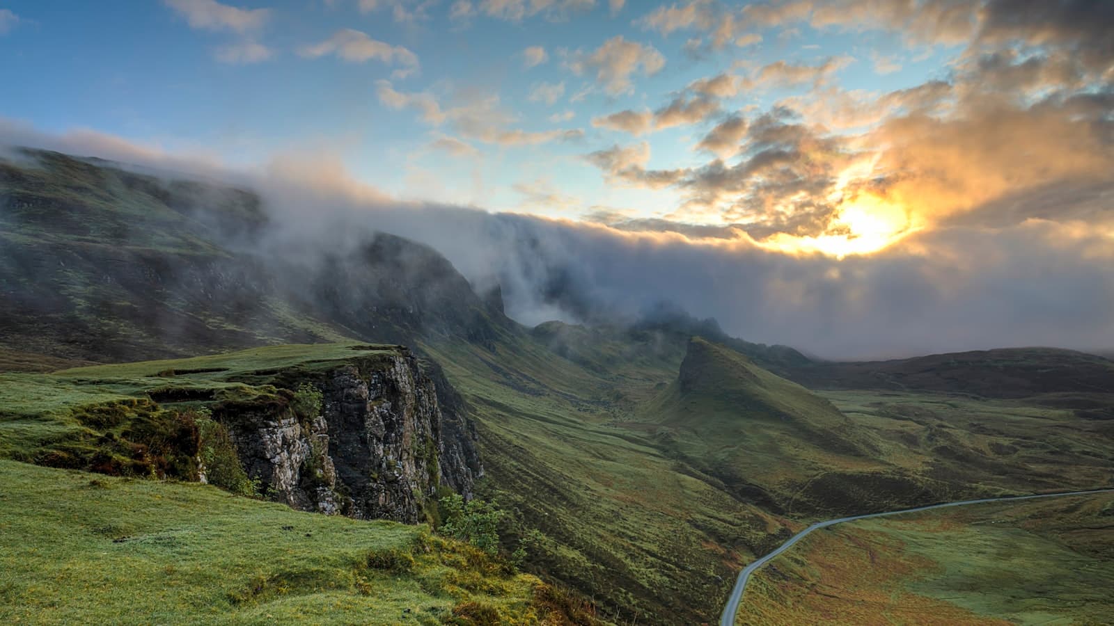Hills and a valley obscured by low cloud