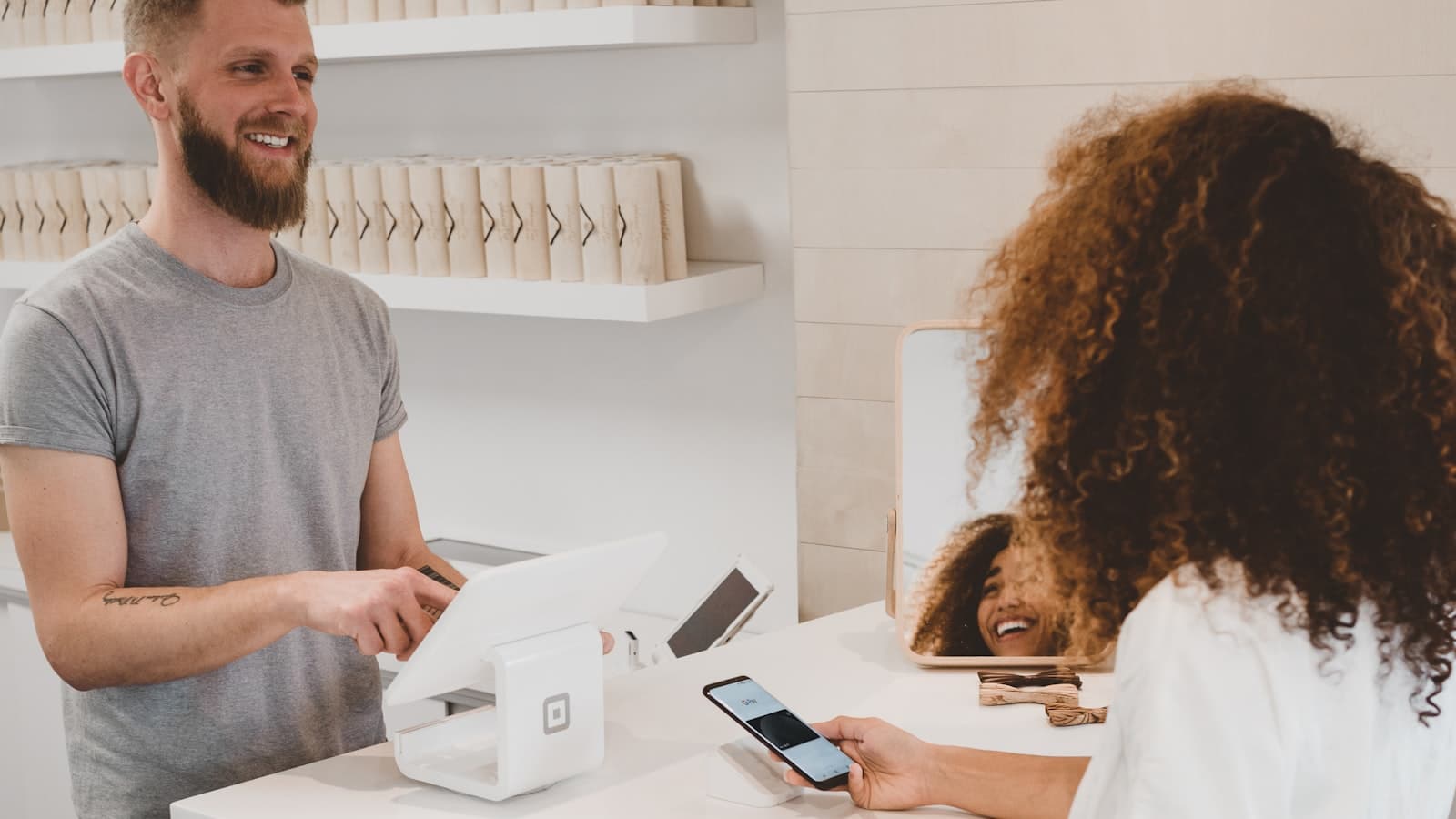 A contactless phone payment at a shop counter
