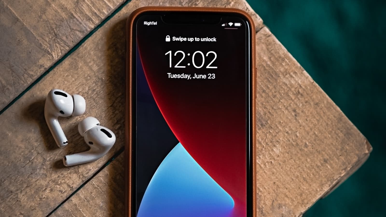 A purple iPhone held in landscape