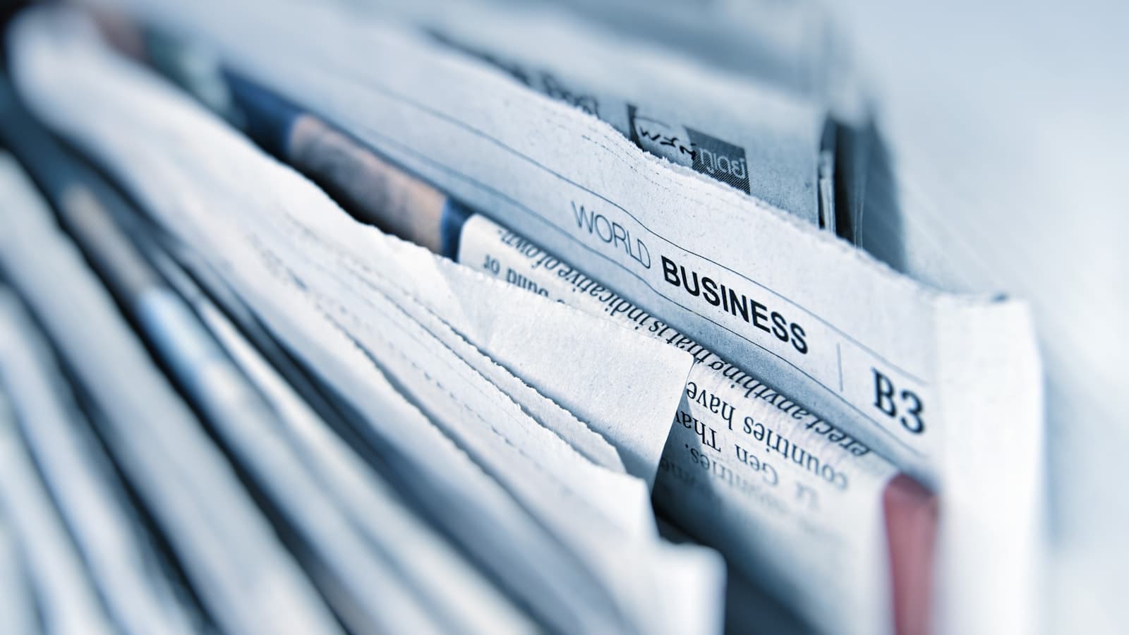 Folded newspapers on a table