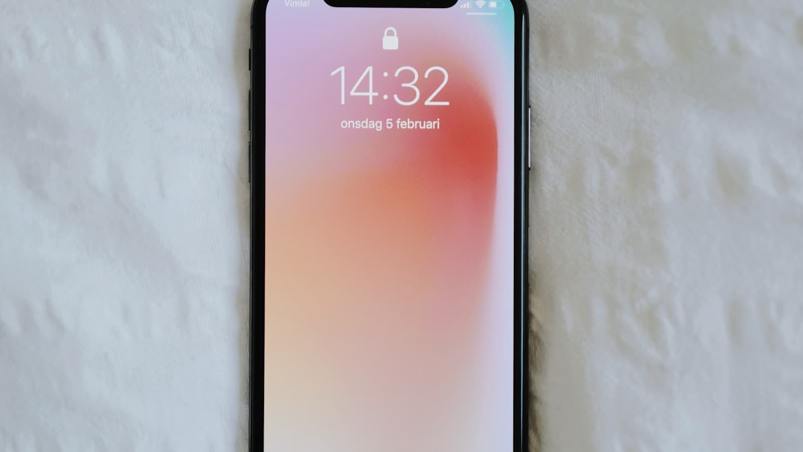 A smartphone lying on a desk